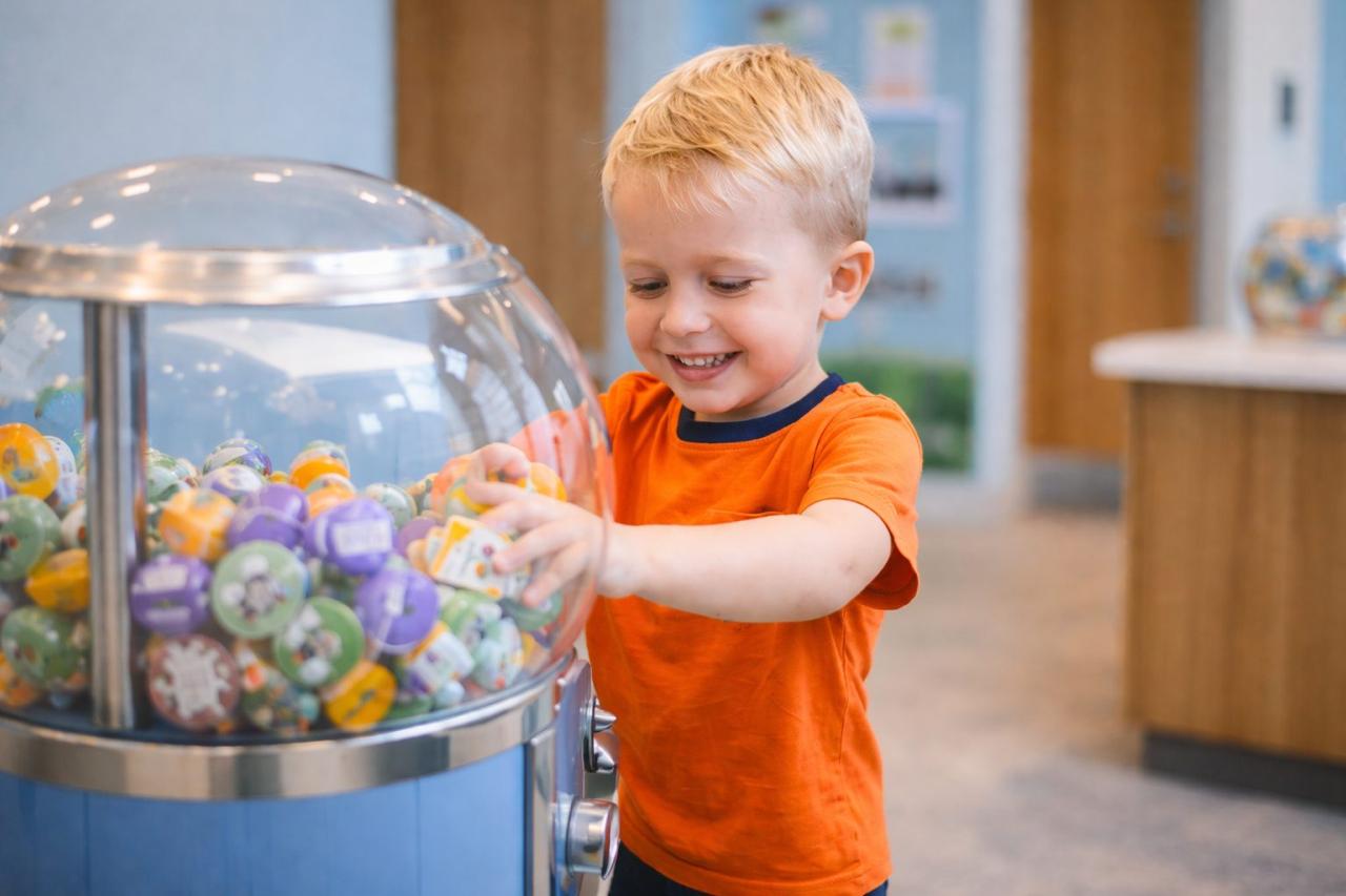 Happy kid picking a prize after dental visit